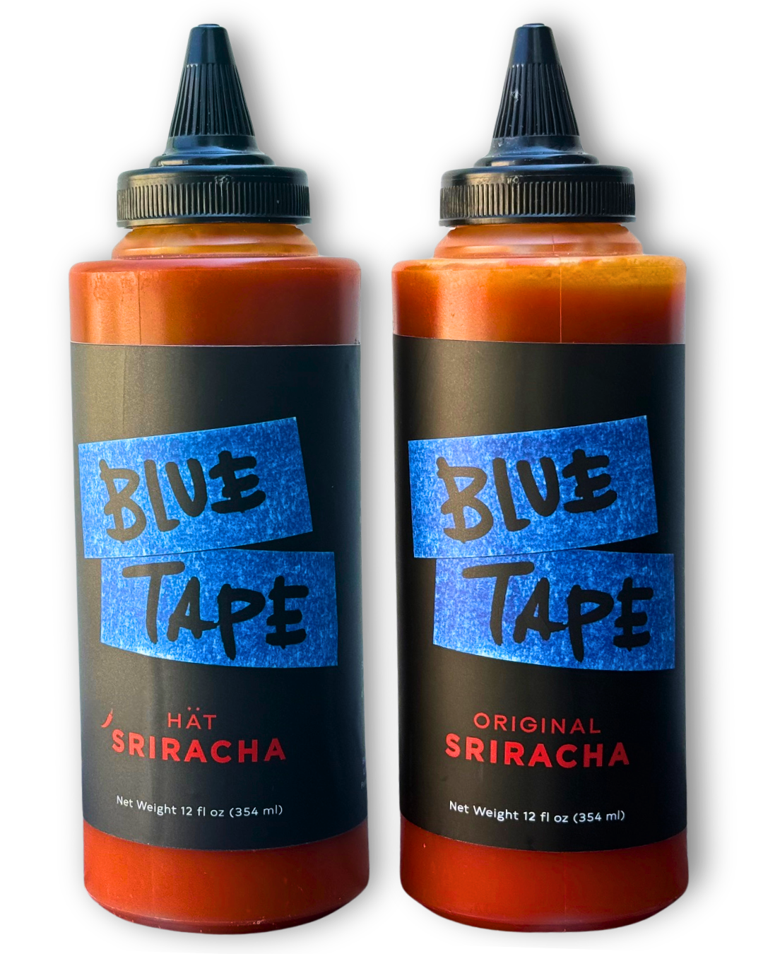 Two squeeze bottles of Blue Tape Sriracha sauce on a plain white background. One bottle is labeled 'HAT SRIRACHA' and the other 'ORIGINAL SRIRACHA', both filled with a reddish-orange sauce and featuring black labels with blue and red text.